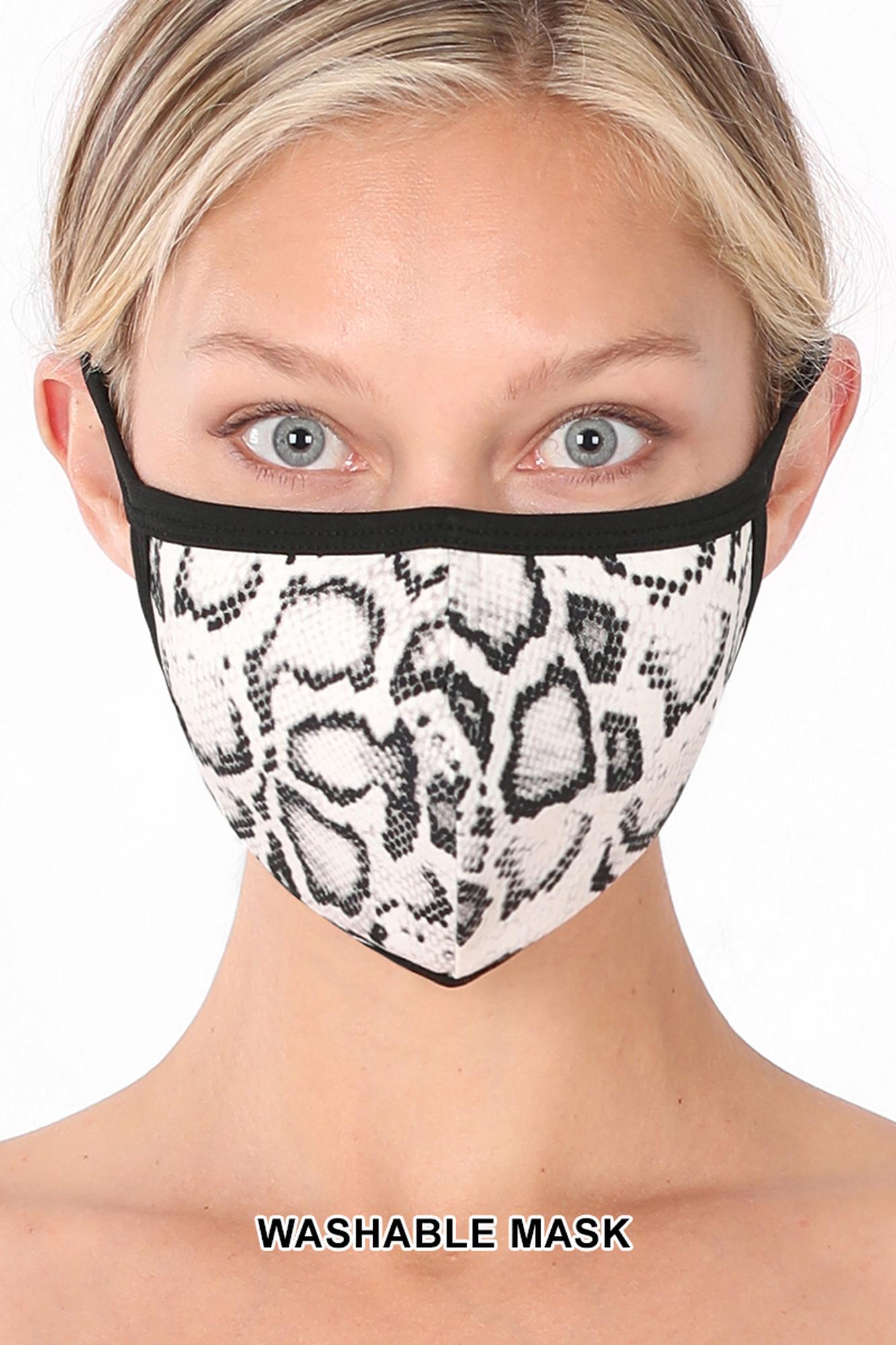 Woman wearing a snake print face mask with 'WASHABLE MASK' text on a white background